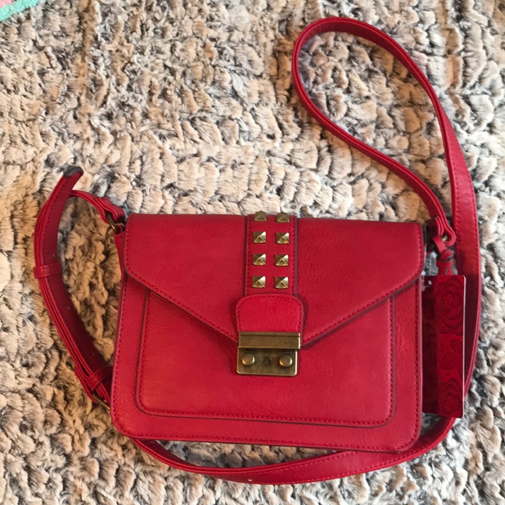 Carlos by Carlos Santana red bag. NWT